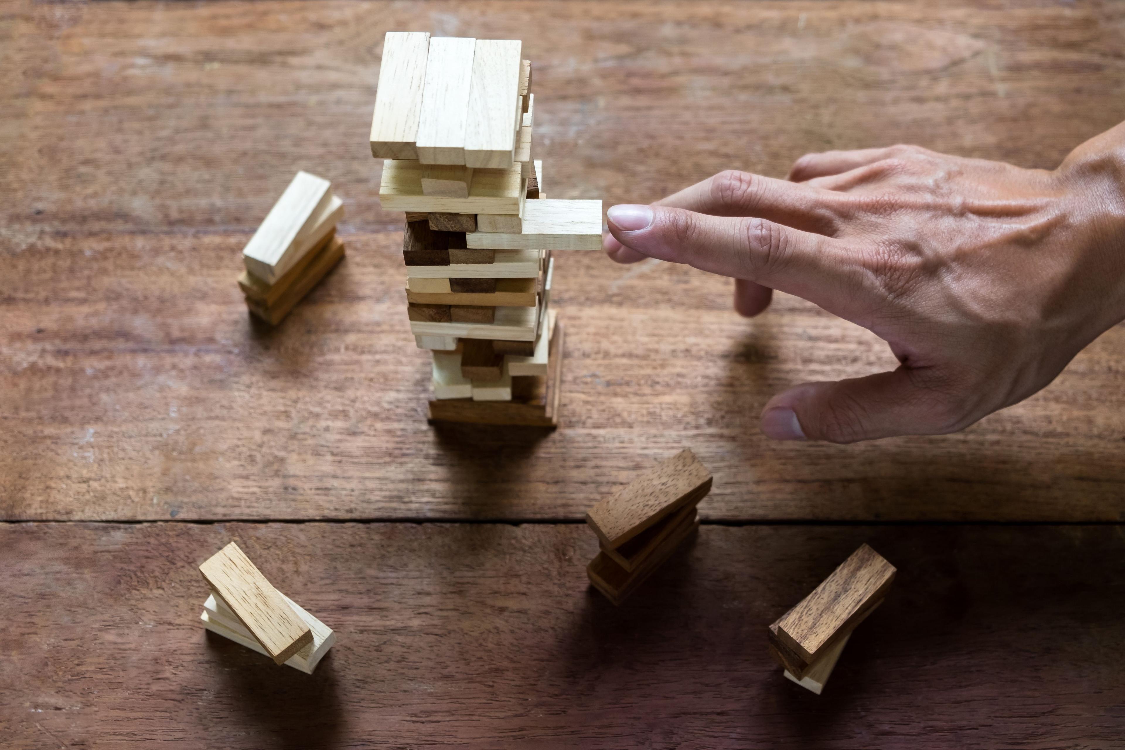 planning-risk-strategy-business-businessman-engineer-gambling-placing-wooden-block-tower.jpg